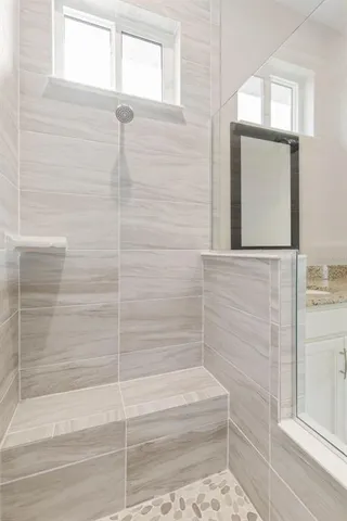 a view of a lake with houses in the back