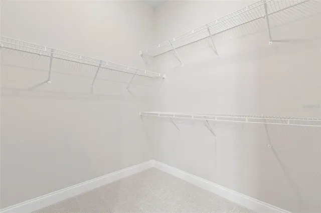 a front view of a house with a yard table and chairs