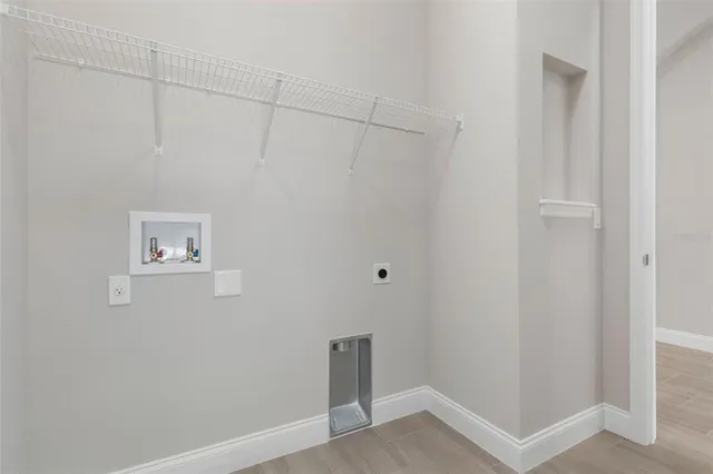 an aerial view of a house with outdoor space and lake view