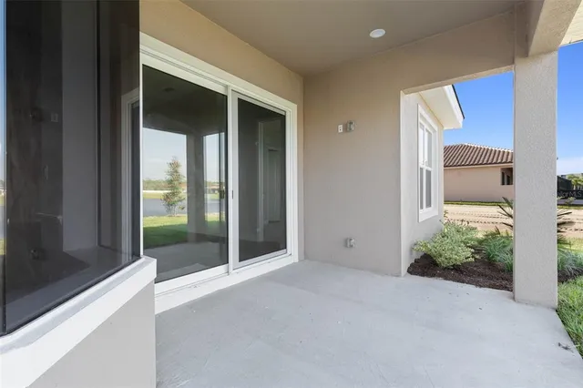 an aerial view of a house with a ocean view