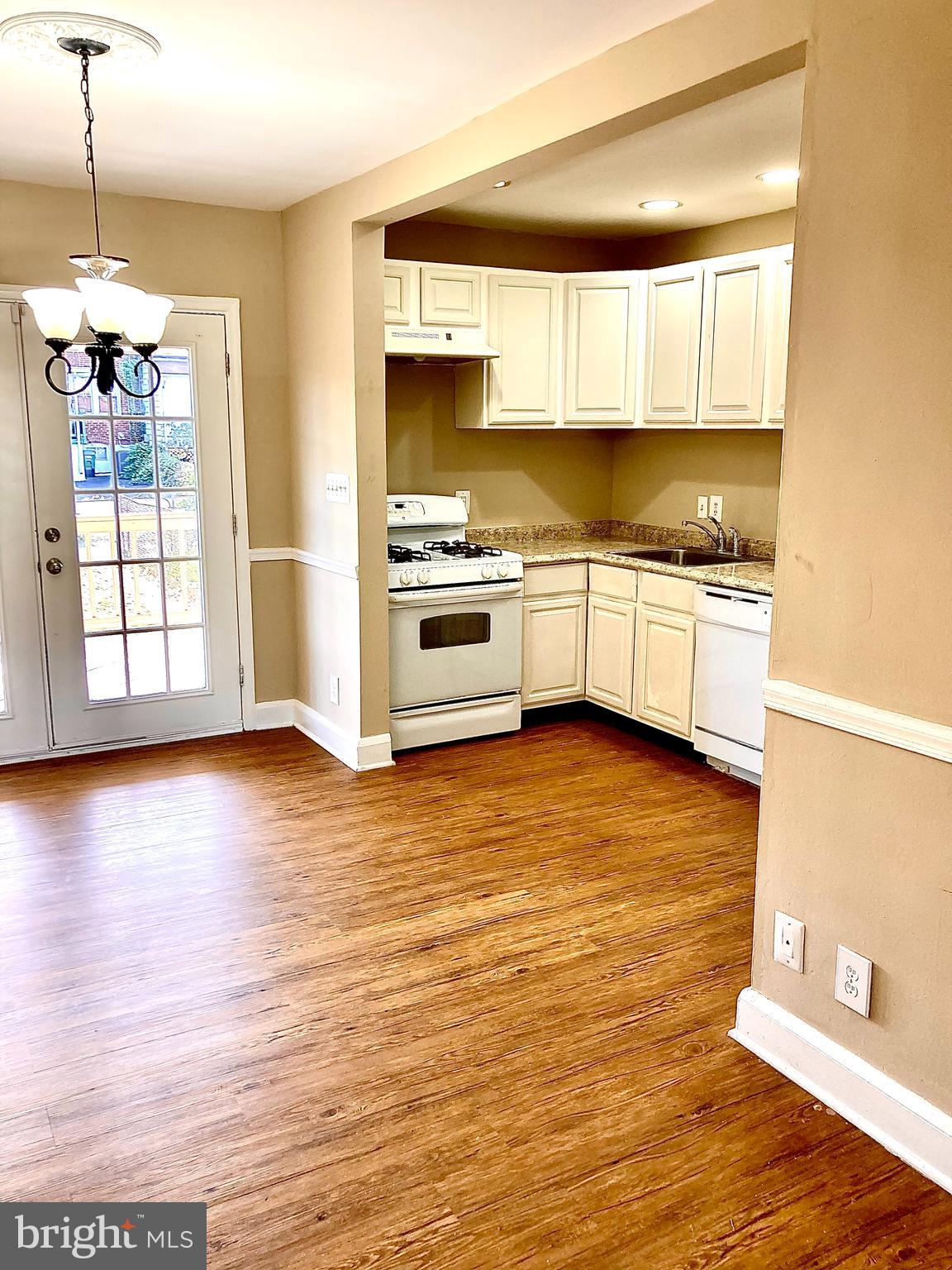 247 West Meadow Road Baltimore, MD 21225 - Photo 8 of 28 Laminate flooring throughout Main level
