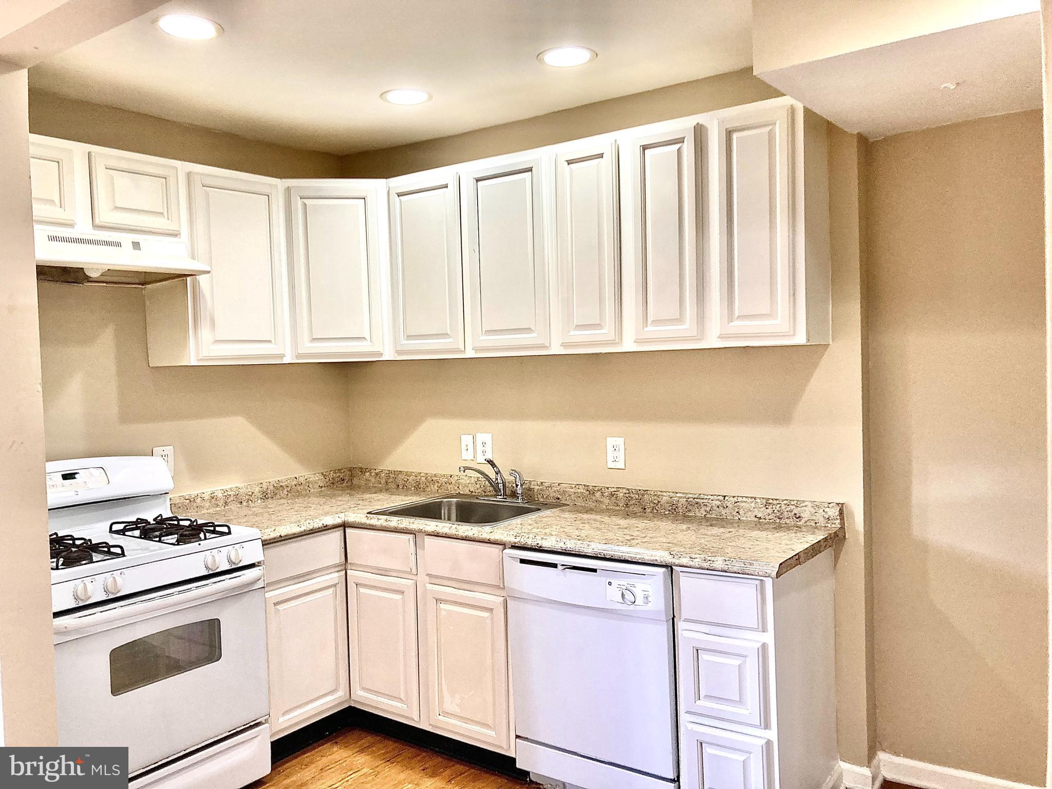 247 West Meadow Road Baltimore, MD 21225 - Photo 9 of 28 White on white Kitchen