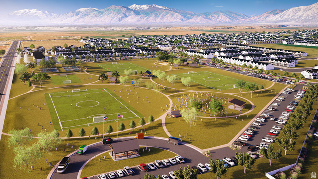2032 East Dorset Way, Unit 286 Salem, UT 84653 - Photo 21 of 23 Expansive community green space featuring multiple sports fields, paved walking paths, a covered pavilion, and surrounding residential structures