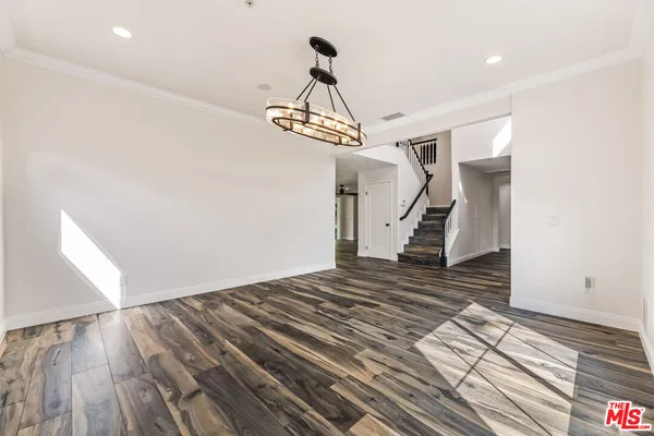 a view of a livingroom with wooden floor