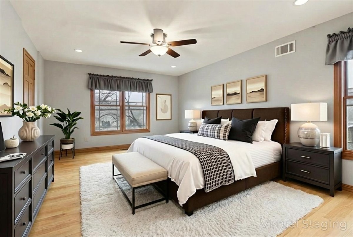 818 Wescott Road Bolingbrook, IL 60440 - Photo 17 of 33 a spacious bedroom with a bed and ceiling fan