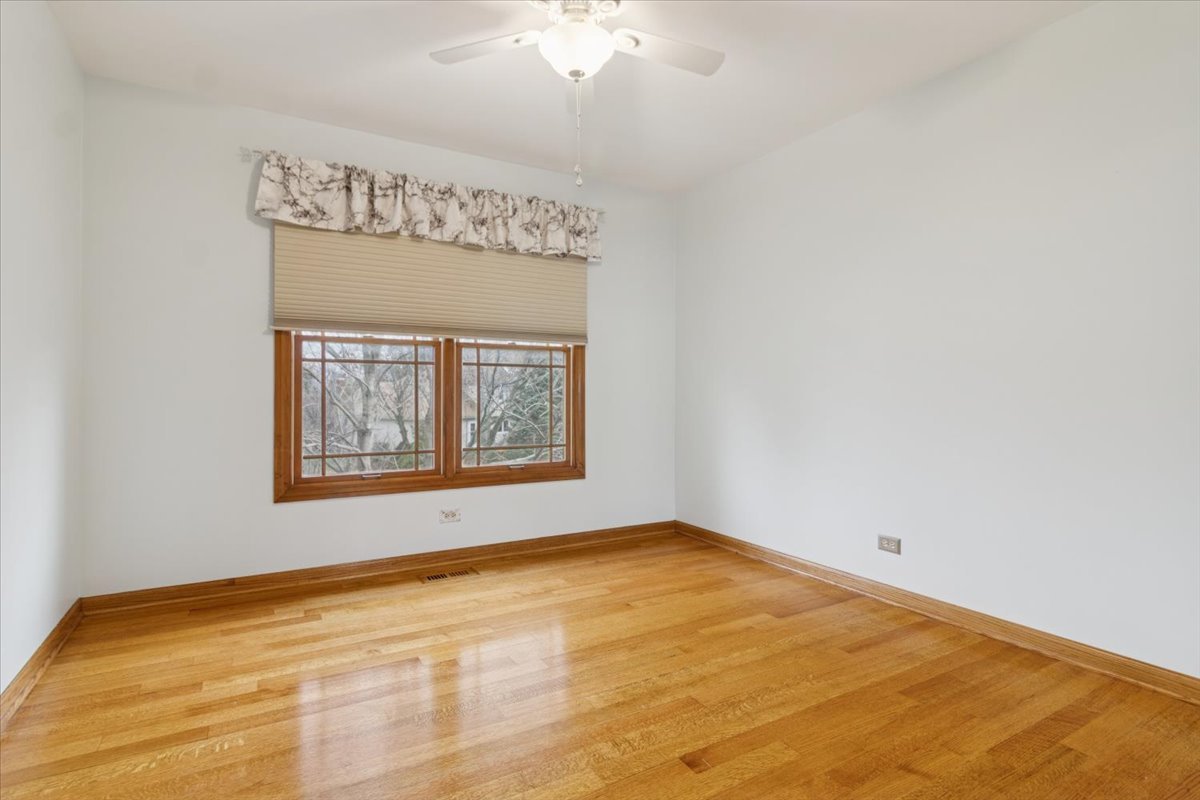 818 Wescott Road Bolingbrook, IL 60440 - Photo 22 of 33 a view of an empty room with a window