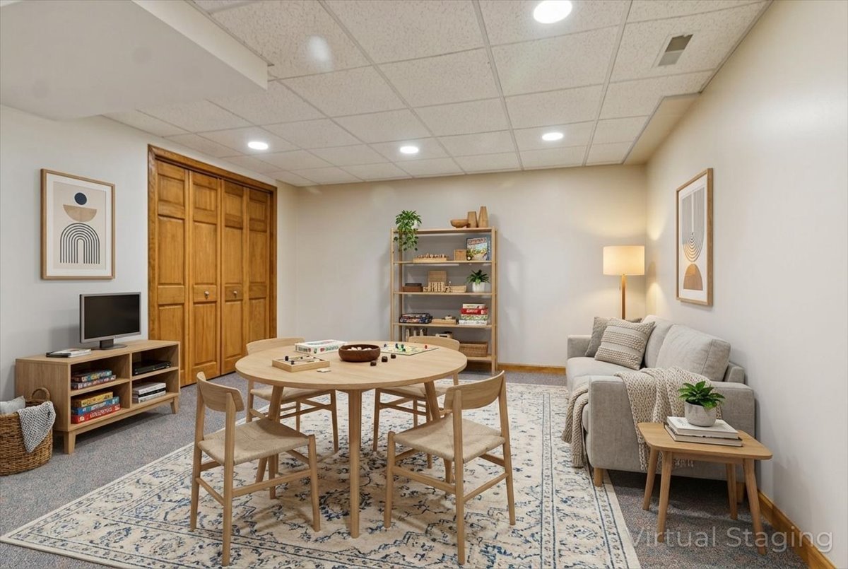 818 Wescott Road Bolingbrook, IL 60440 - Photo 25 of 33 a living room with furniture a flat screen tv and a table