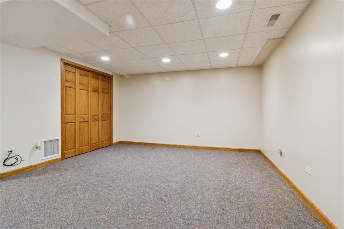 818 Wescott Road Bolingbrook, IL 60440 - Photo 26 of 33 a view of an empty room with a window