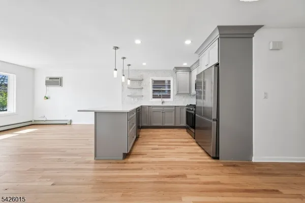 a view of kitchen with wooden floor