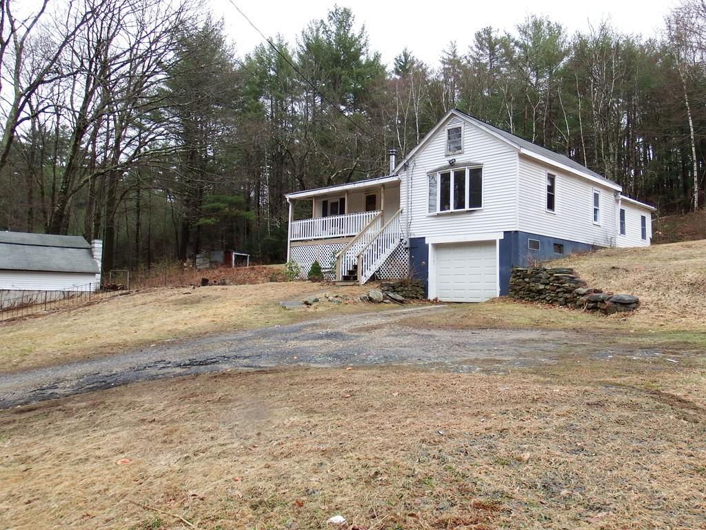 859 Turnpike Road Ashby, MA 01431 - Photo 2 of 22 a view of a yard with a house in the background
