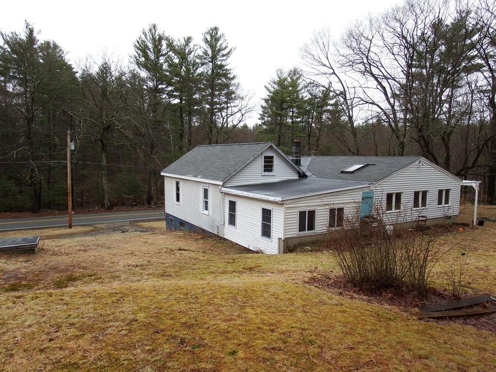 859 Turnpike Road Ashby, MA 01431 - Photo 22 of 22 a house that has a tree in front of it