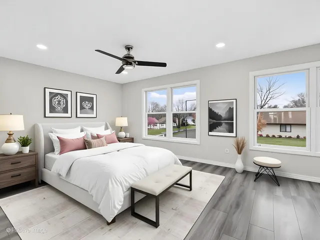 a bedroom with a large bed and a window