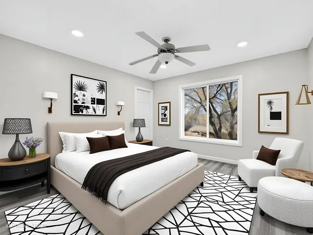 a spacious bedroom with a bed and a couch