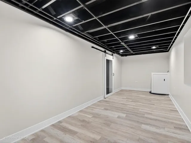 a view of room with wooden floor