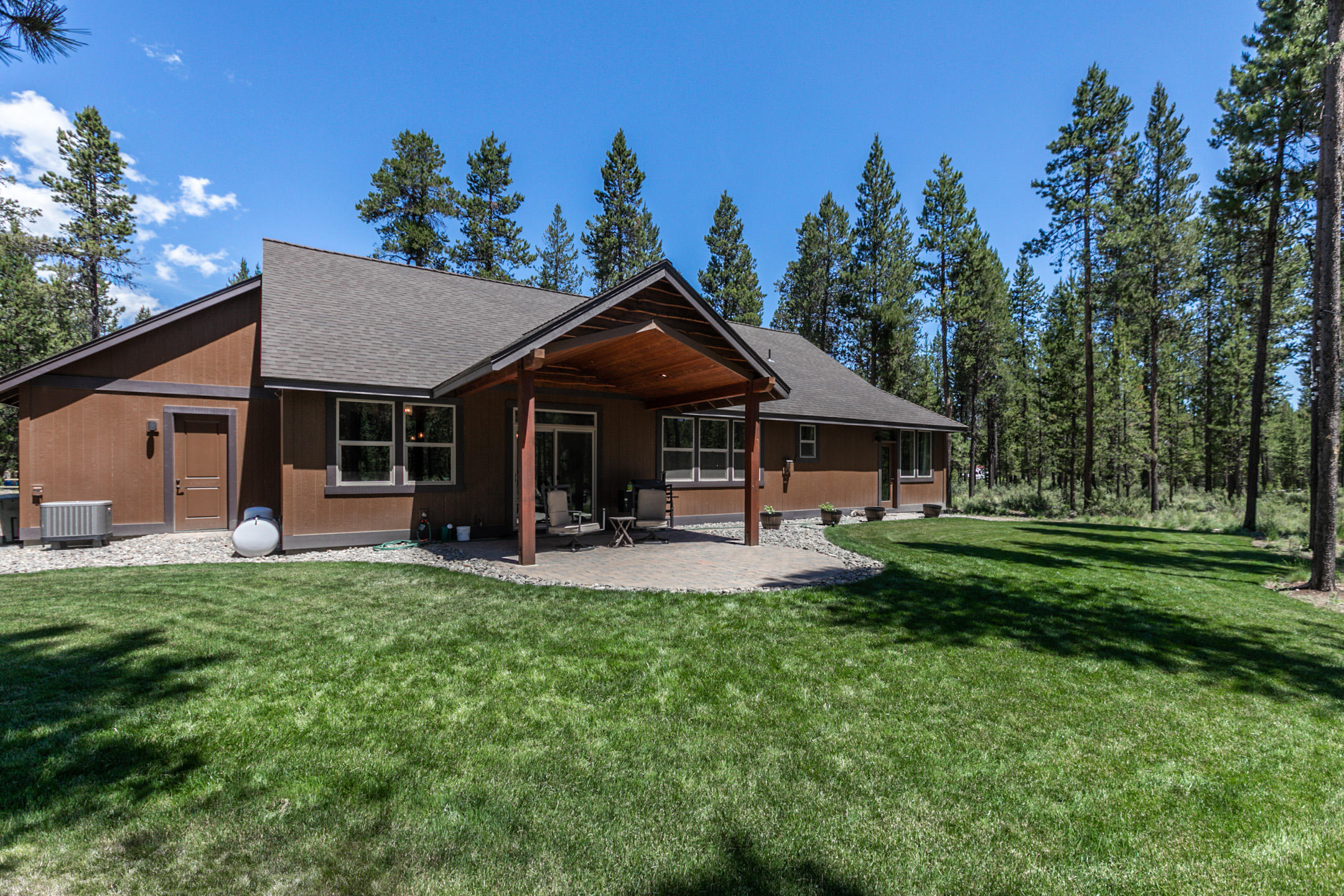 17067 Glendale Road Bend, OR 97707 - Photo 6 of 29 a front view of a house with garden