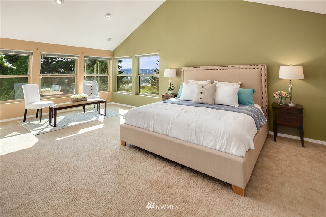 573 Bronson Place Northeast Renton, WA 98056 - Photo 11 of 32 a spacious bedroom with a bed and a large window