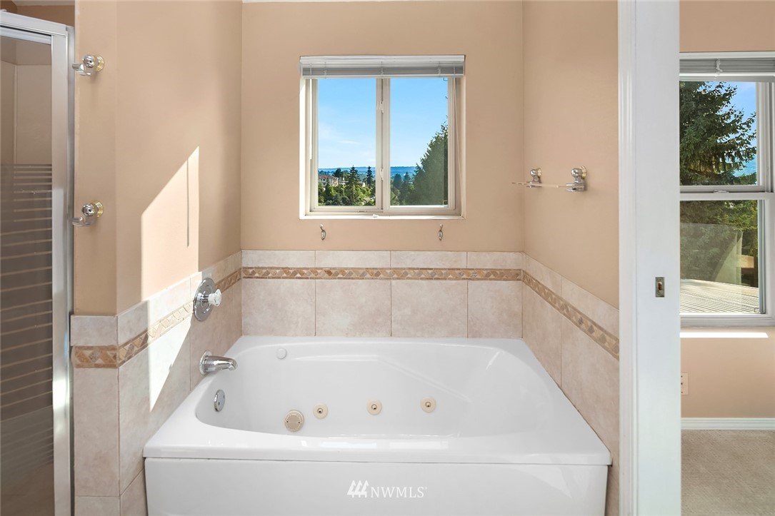 573 Bronson Place Northeast Renton, WA 98056 - Photo 14 of 32 a white bath tub sitting next to a window