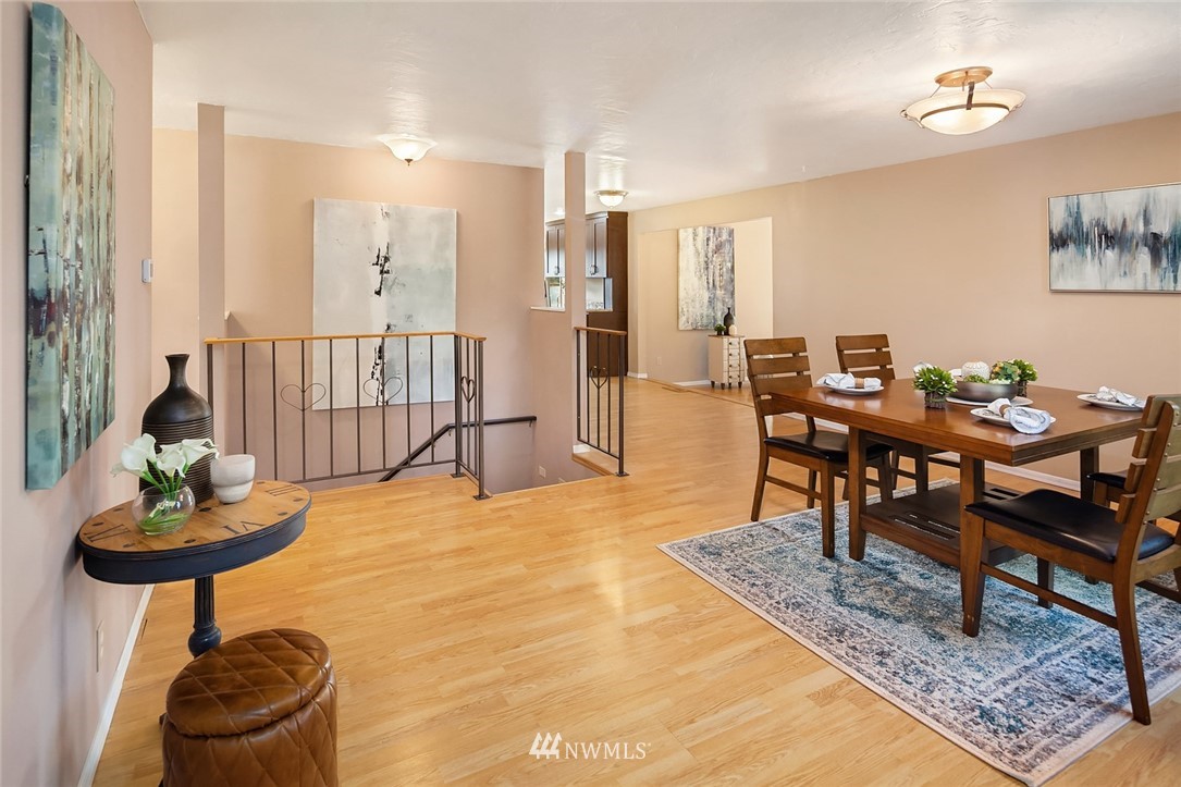 573 Bronson Place Northeast Renton, WA 98056 - Photo 3 of 32 a dining room with furniture and wooden floor