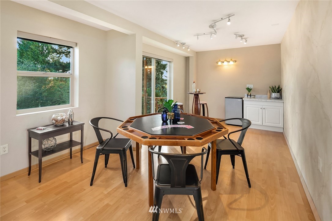 573 Bronson Place Northeast Renton, WA 98056 - Photo 22 of 32 a view of a dining room with furniture and window
