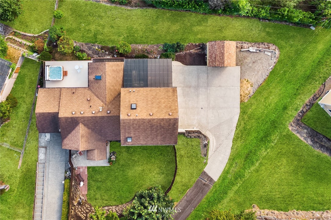 573 Bronson Place Northeast Renton, WA 98056 - Photo 30 of 32 an aerial view of a house with a garden and trees