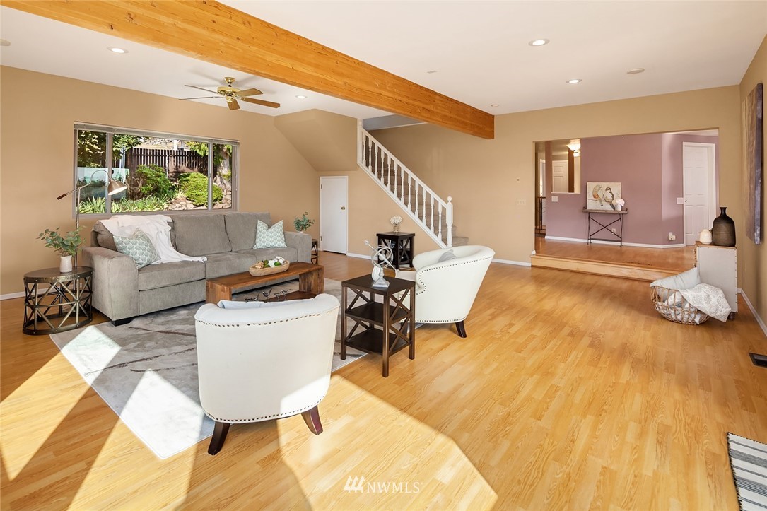 573 Bronson Place Northeast Renton, WA 98056 - Photo 6 of 32 a living room with furniture and a wooden floor