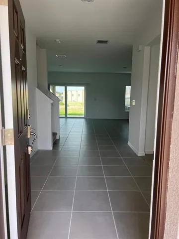 a bathroom with a glass door shower a sink and a mirror