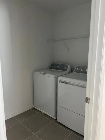 a utility room with dryer and washer