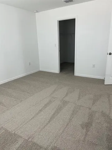 a view of an empty room and closet