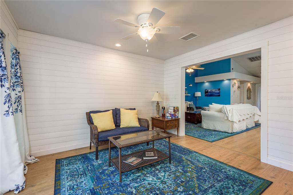102 Anclote Road Tarpon Springs, FL 34689 - Photo 12 of 42 a living room with furniture and a rug