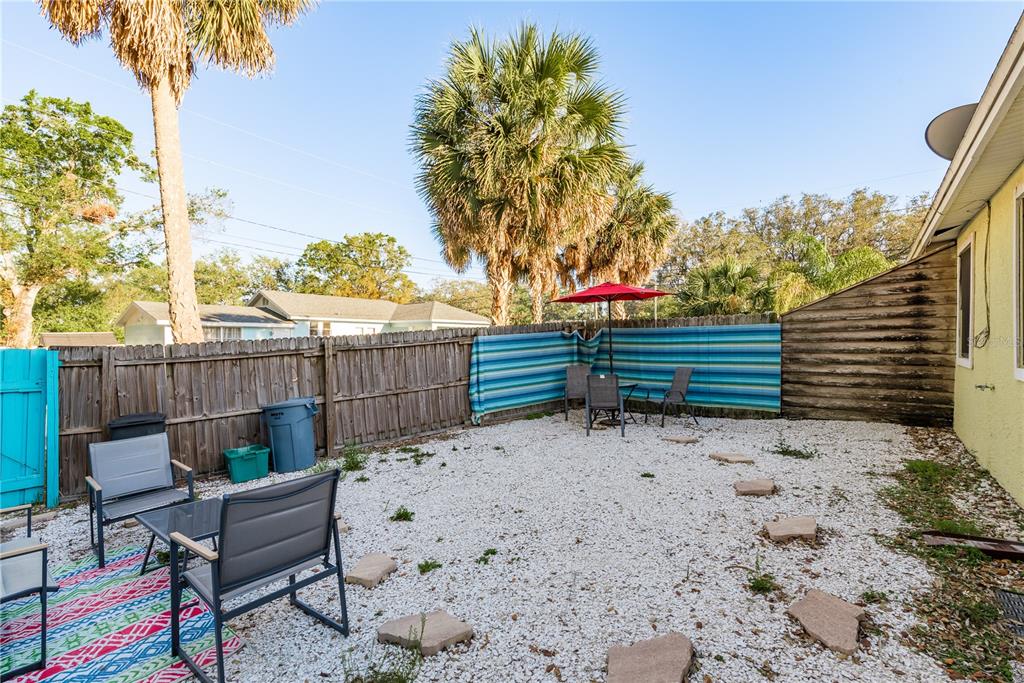 102 Anclote Road Tarpon Springs, FL 34689 - Photo 27 of 42 a view of a bench in the backyard