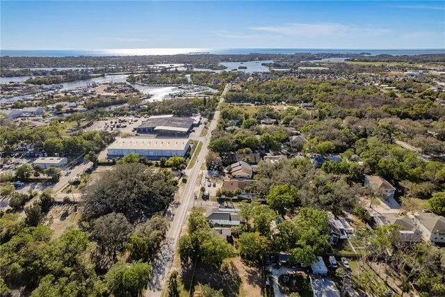 an aerial view of a house with a yard