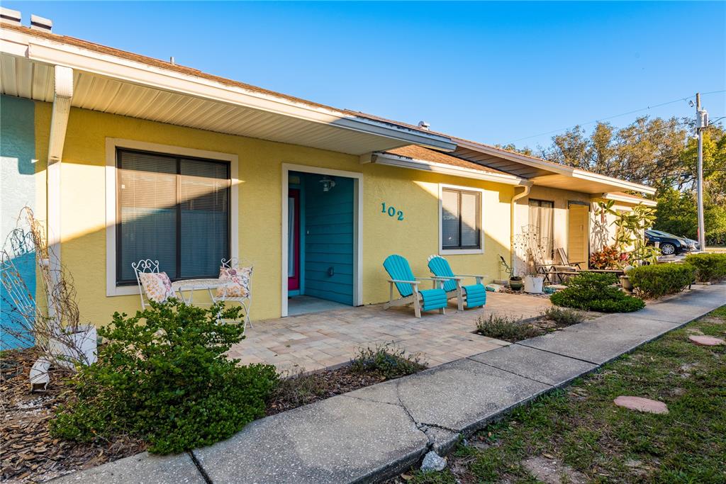 102 Anclote Road Tarpon Springs, FL 34689 - Photo 4 of 42 a front view of a house with garden