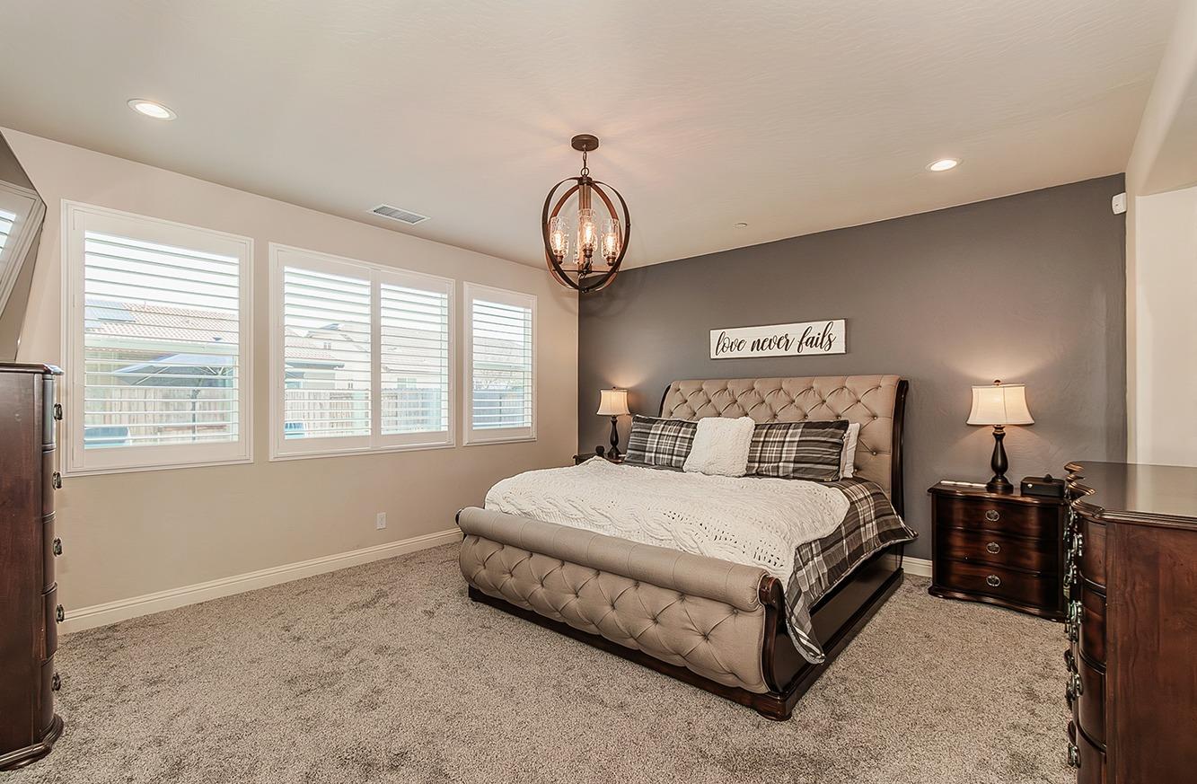 1035 Agua Dulce Avenue Clovis, CA 93619 - Photo 14 of 40 a bedroom with a bed and window