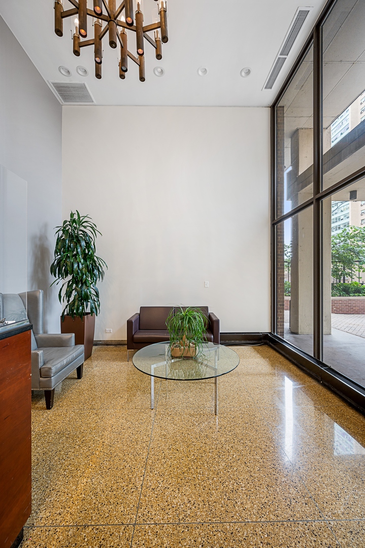 3150 North Sheridan Road, Unit 3C Chicago, IL 60657 - Photo 2 of 19 a view of a livingroom with furniture and floor to ceiling window