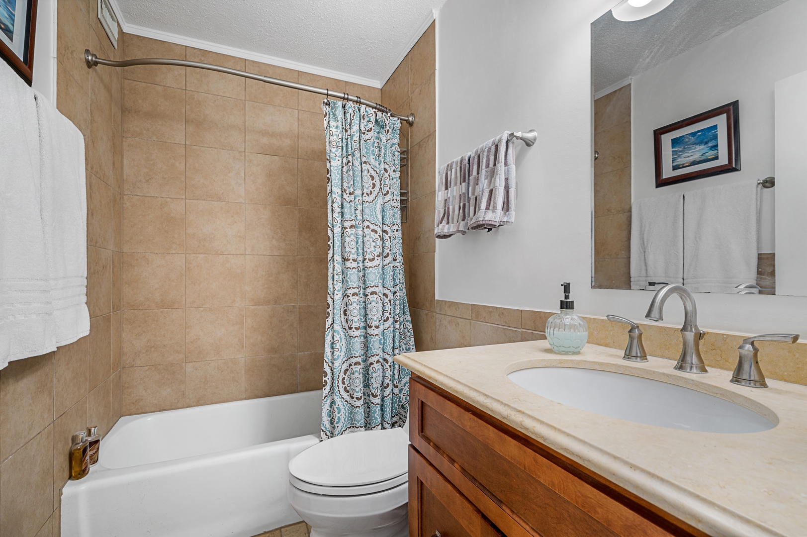 3150 North Sheridan Road, Unit 3C Chicago, IL 60657 - Photo 15 of 19 a bathroom with a granite countertop sink a toilet a shower curtain and a bath tub