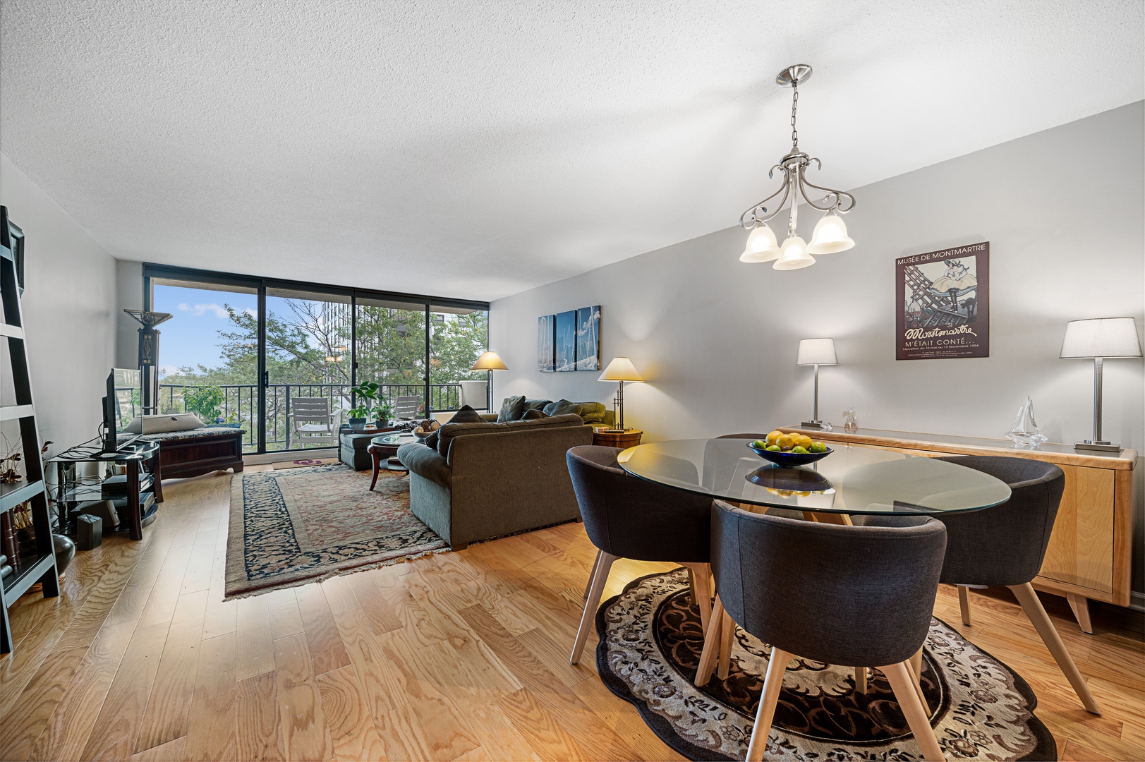 3150 North Sheridan Road, Unit 3C Chicago, IL 60657 - Photo 5 of 19 a living room with furniture and a chandelier