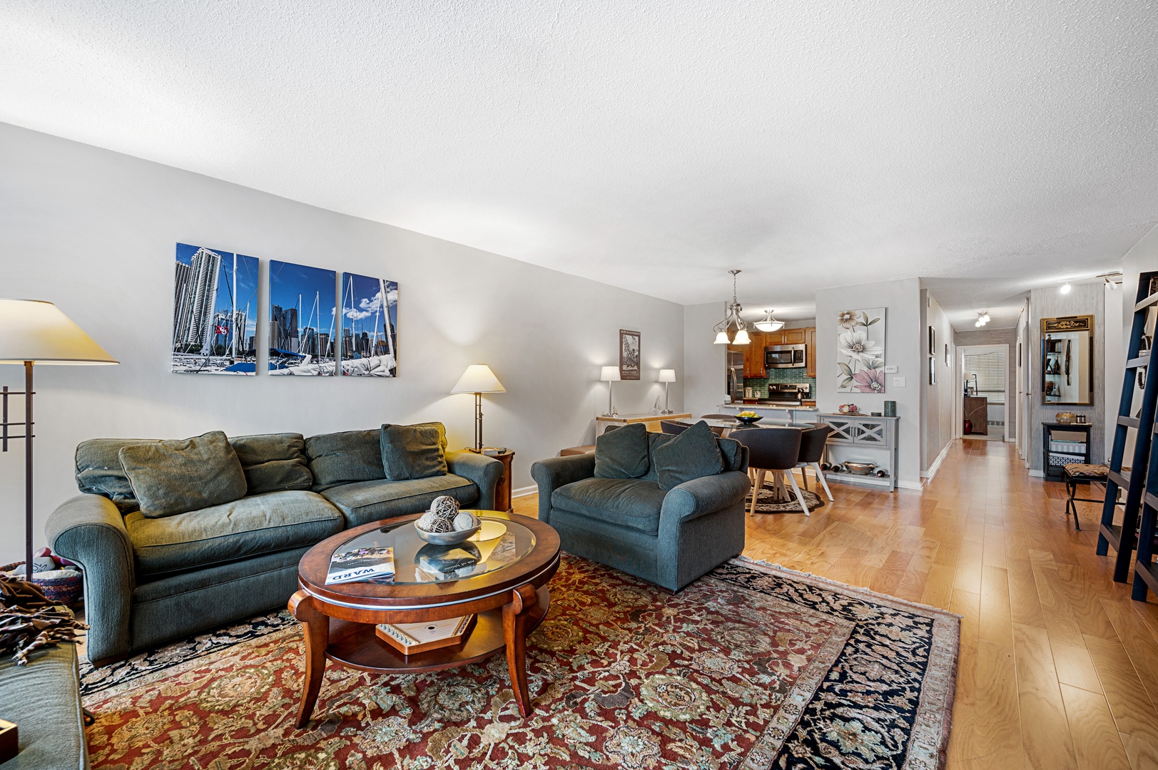 3150 North Sheridan Road, Unit 3C Chicago, IL 60657 - Photo 8 of 19 a living room with furniture and a wooden floor