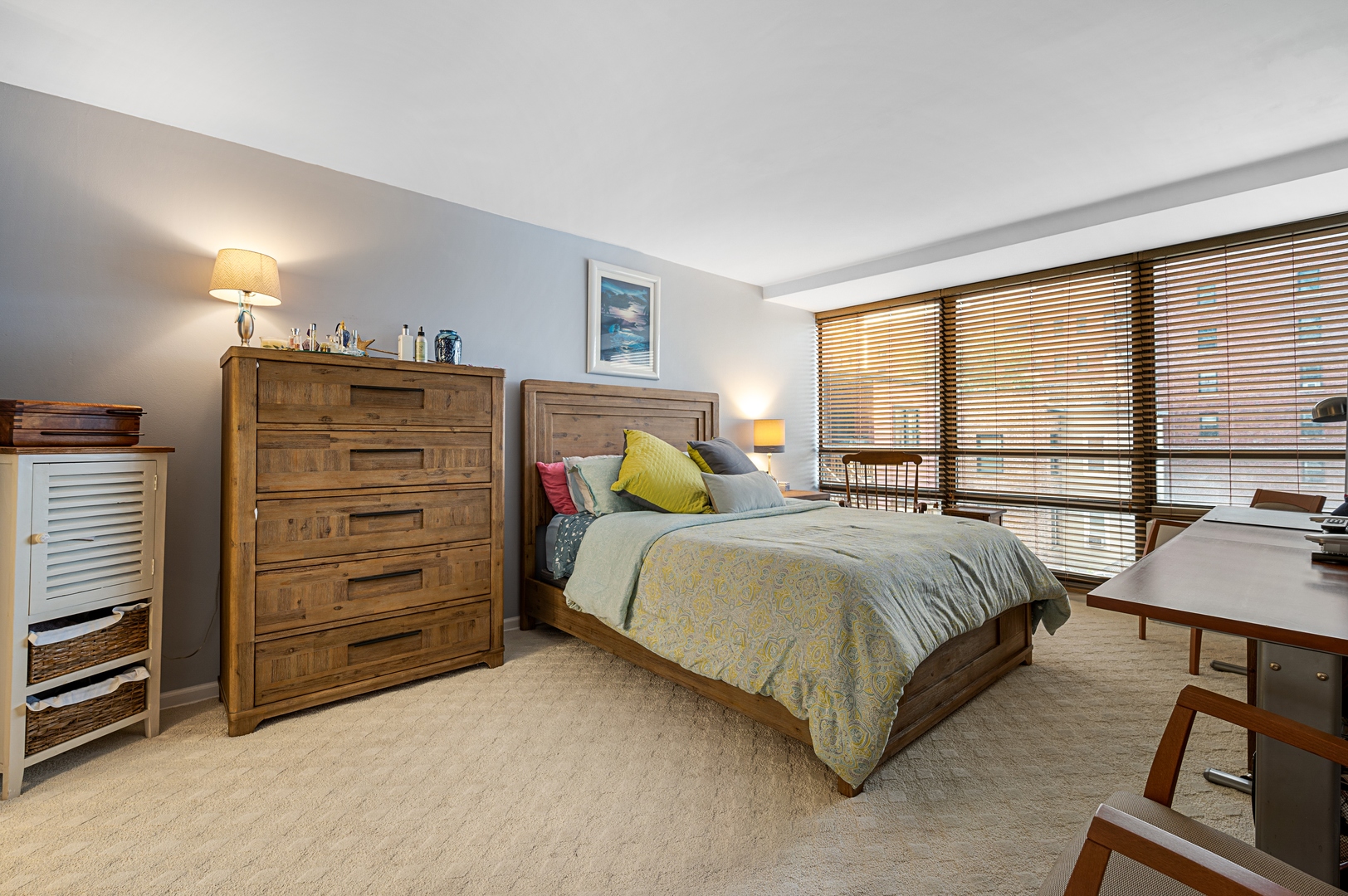 3150 North Sheridan Road, Unit 3C Chicago, IL 60657 - Photo 10 of 19 a bedroom with a bed and a dresser