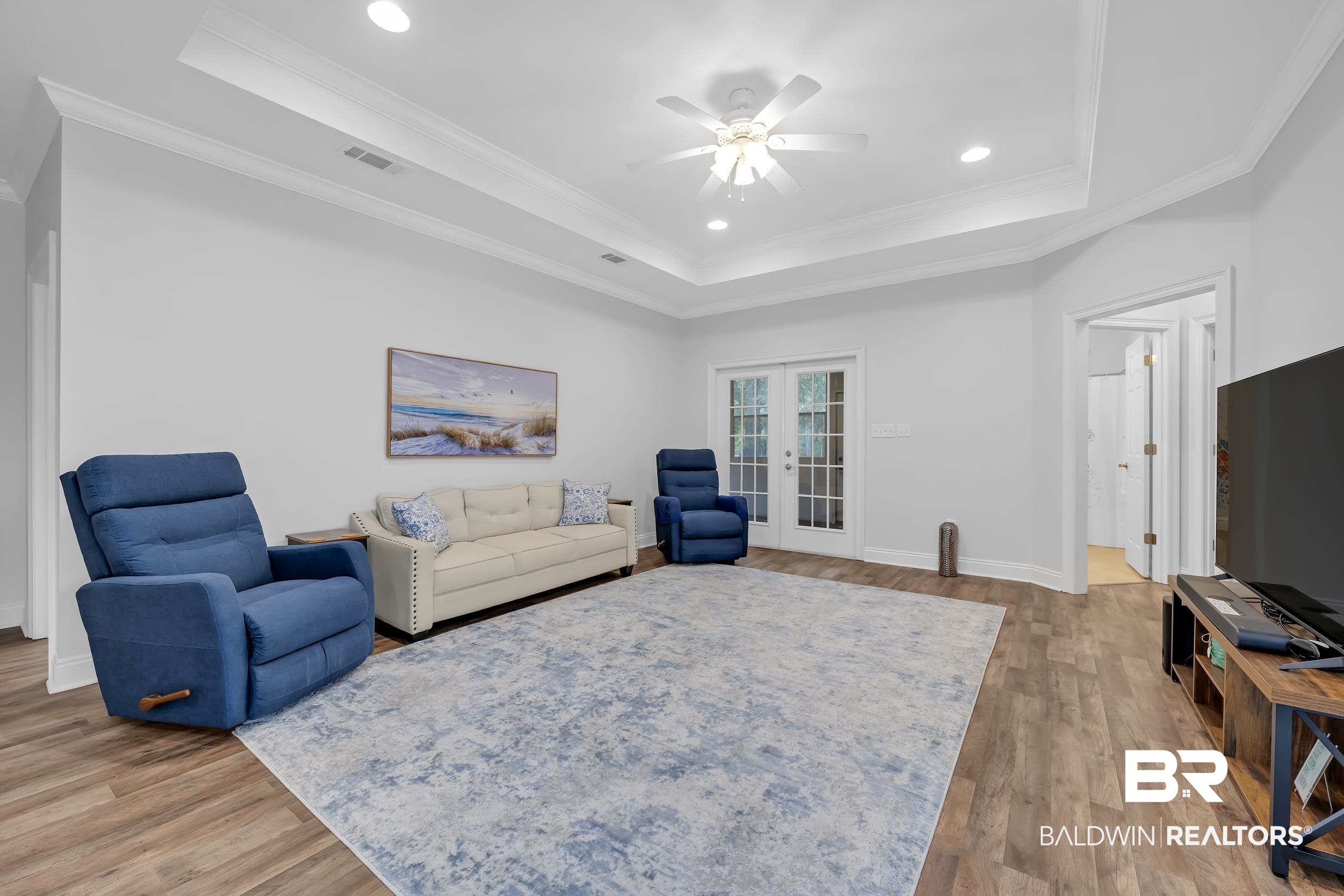 105 Mark Twain Loop Foley, AL 36535 - Photo 8 of 43 Living area with french doors, recessed lighting, light wood-style floors, ornamental molding, and a ceiling fan