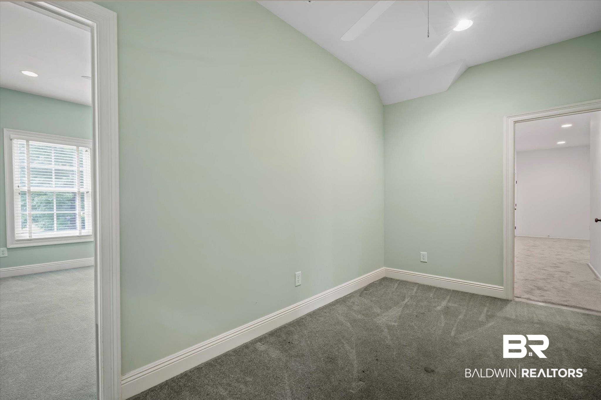 812 Country Club Court Mobile, AL 36609 - Photo 22 of 34 Unfurnished room with carpet flooring, ceiling fan, and lofted ceiling