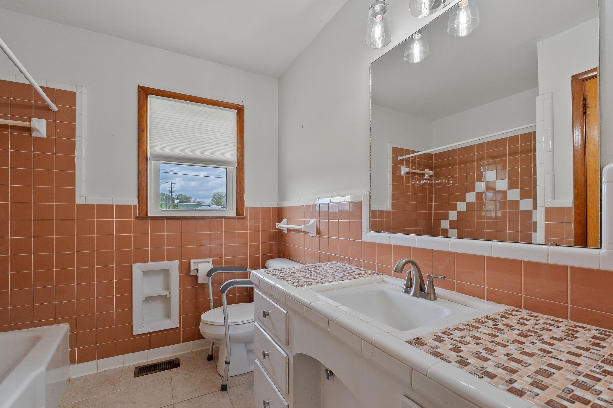 401 Whaley Street Smithville, TN 37166 - Photo 11 of 37 a bathroom with a sink a toilet and mirror