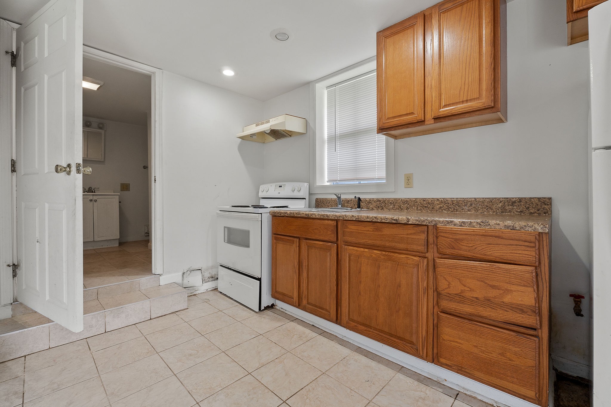 401 Whaley Street Smithville, TN 37166 - Photo 34 of 37 a room with granite countertop cabinets and utility room