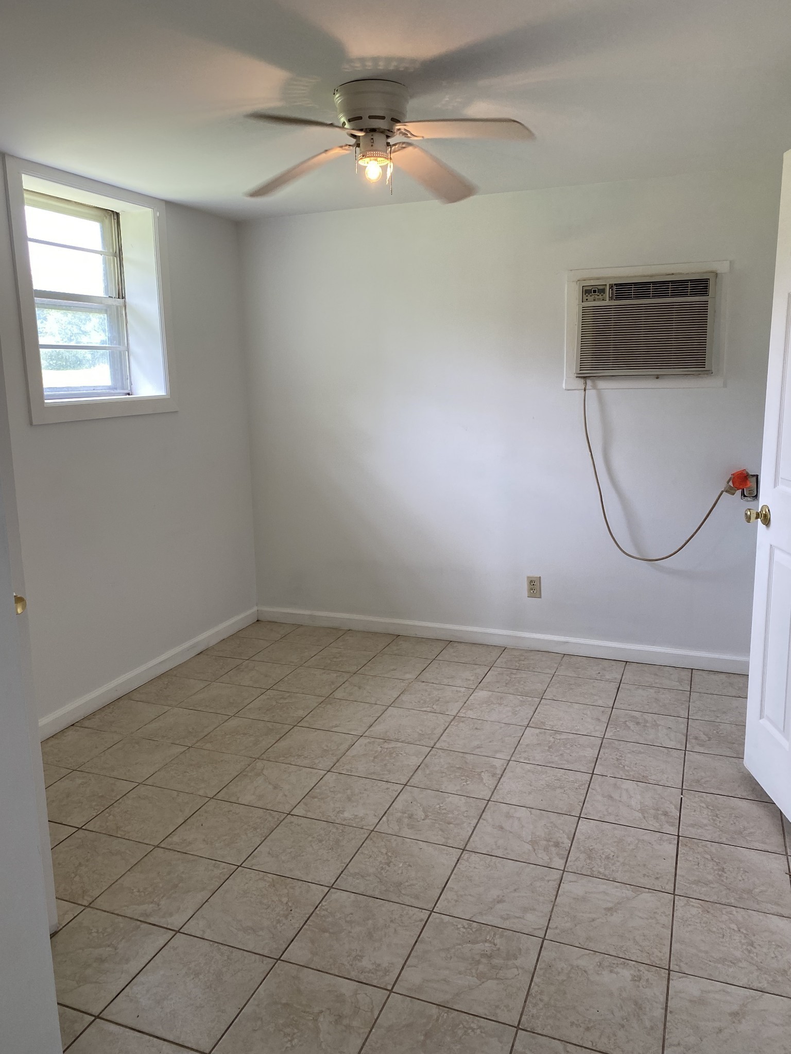 401 Whaley Street Smithville, TN 37166 - Photo 36 of 37 an empty room with windows and fan
