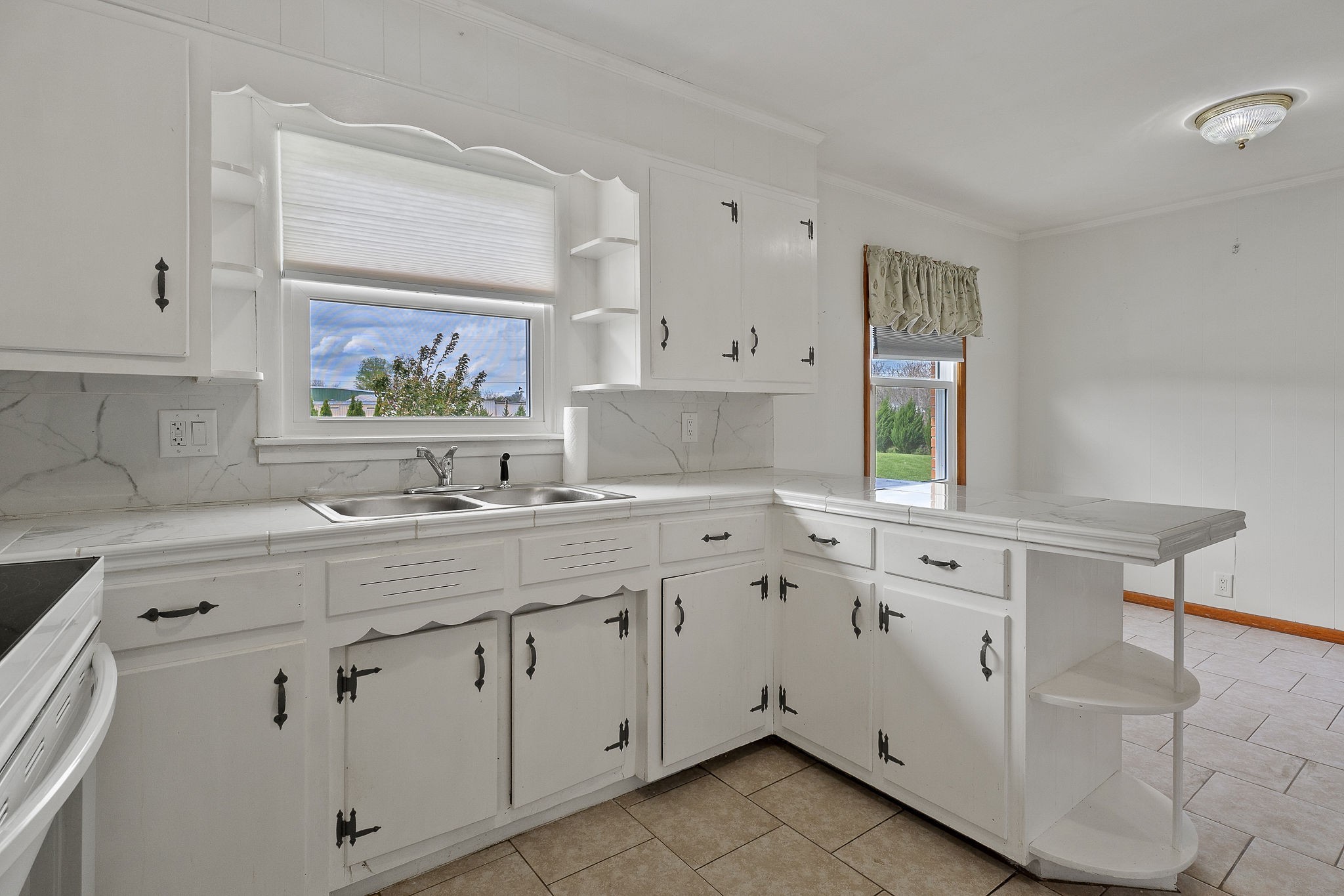 401 Whaley Street Smithville, TN 37166 - Photo 6 of 37 a kitchen with white cabinets and sink