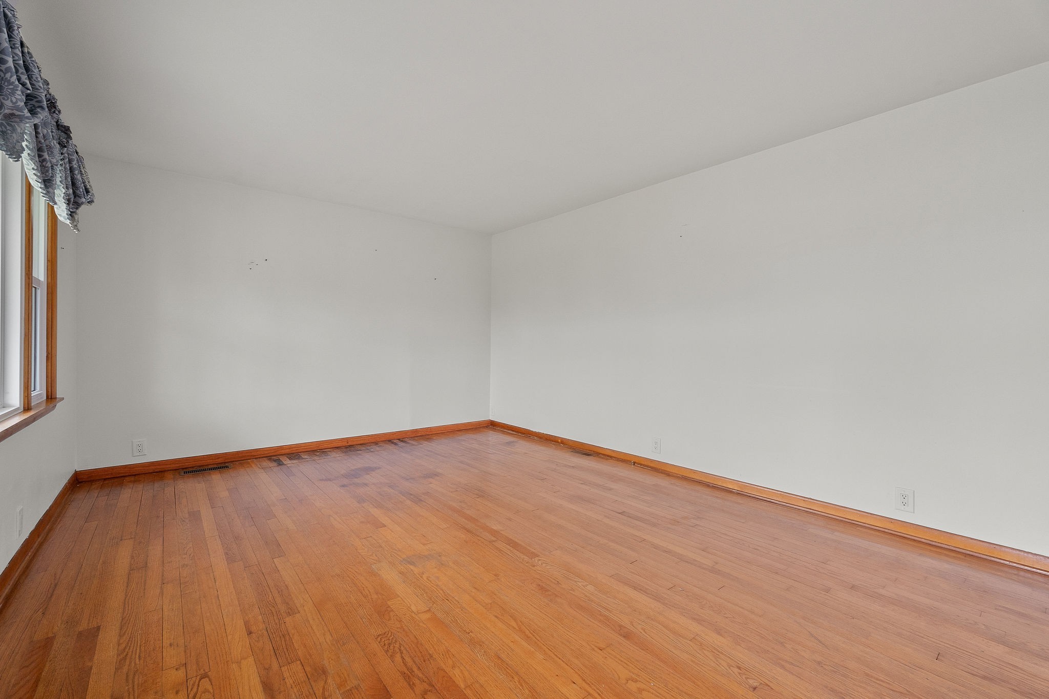 401 Whaley Street Smithville, TN 37166 - Photo 8 of 37 a view of empty room with wooden floor and fan