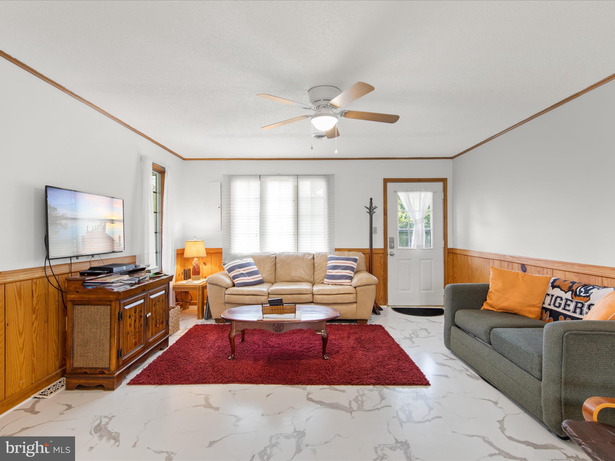 23451 Deal Island Road Deal Island, MD 21821 - Photo 17 of 49 a living room with furniture ceiling fan and a window