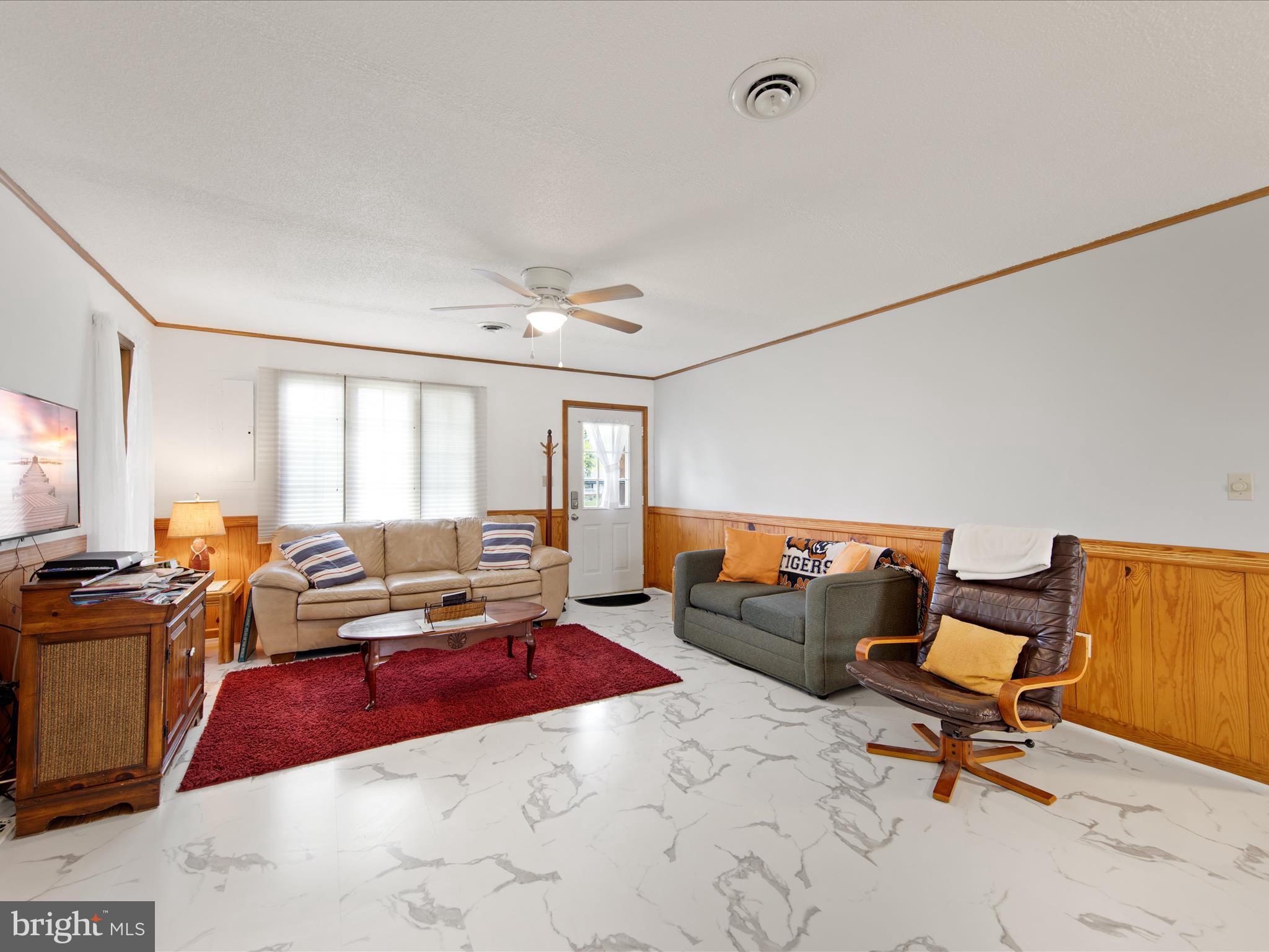 23451 Deal Island Road Deal Island, MD 21821 - Photo 18 of 49 a living room with furniture window and a table