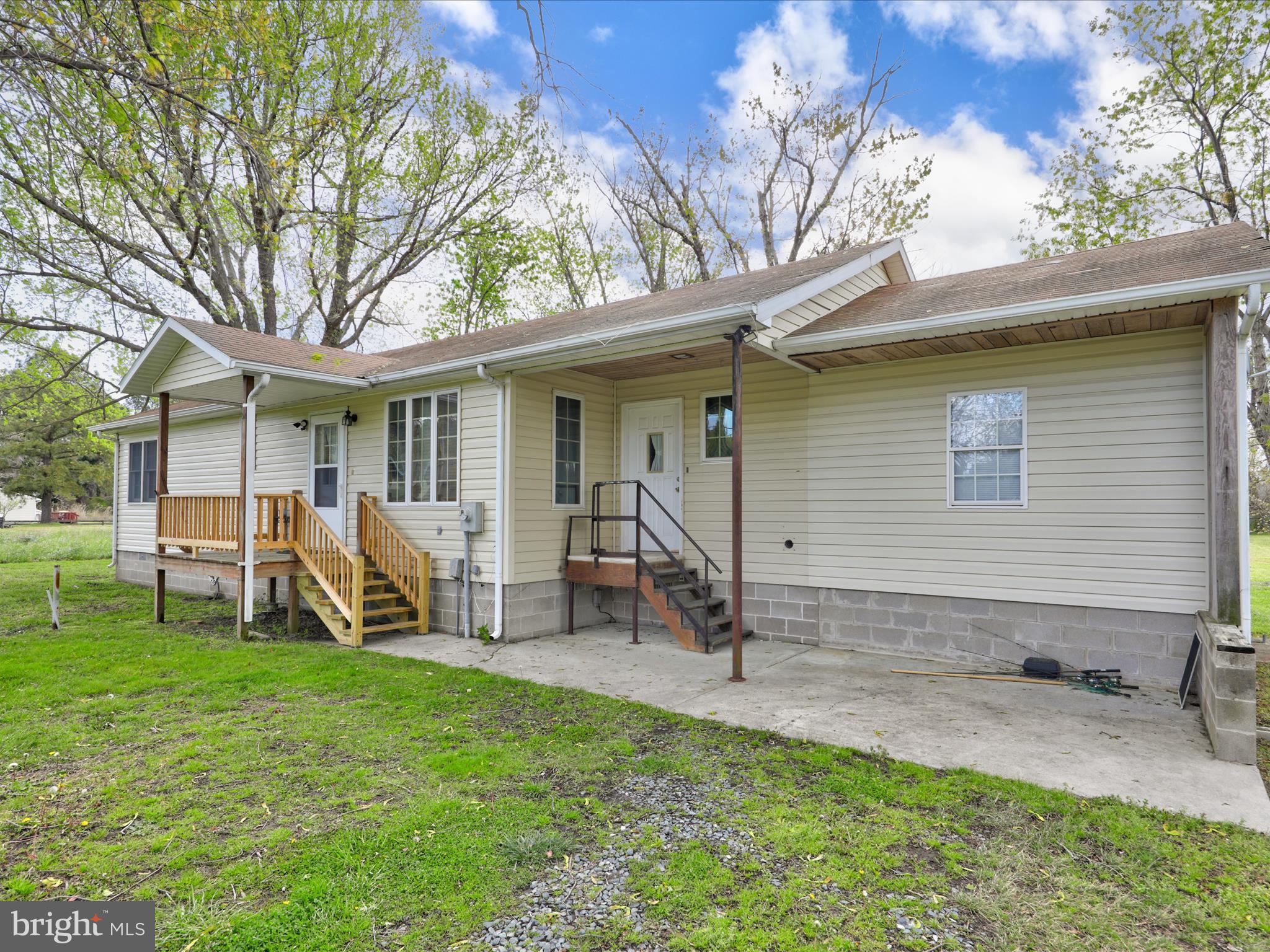 23451 Deal Island Road Deal Island, MD 21821 - Photo 2 of 49 a view of a house with backyard porch and sitting area