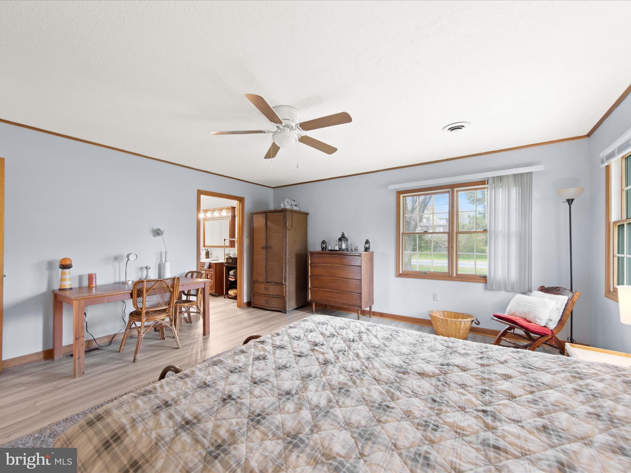 23451 Deal Island Road Deal Island, MD 21821 - Photo 26 of 49 a large bedroom with wooden floor and a window