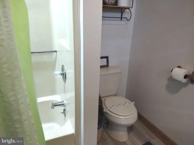 a bathroom with a toilet and a sink